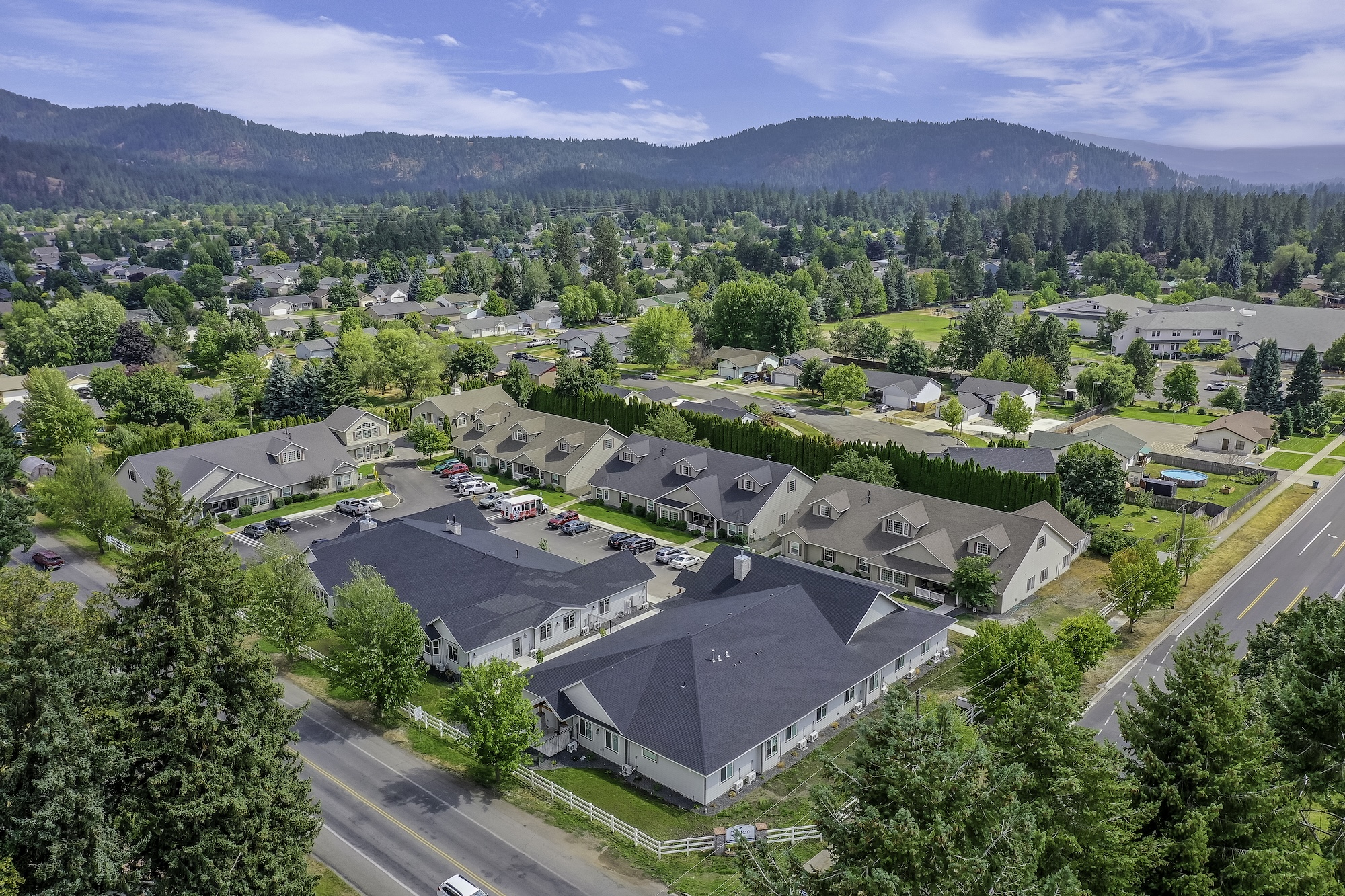 aerial view of community and surrounding neighborhood